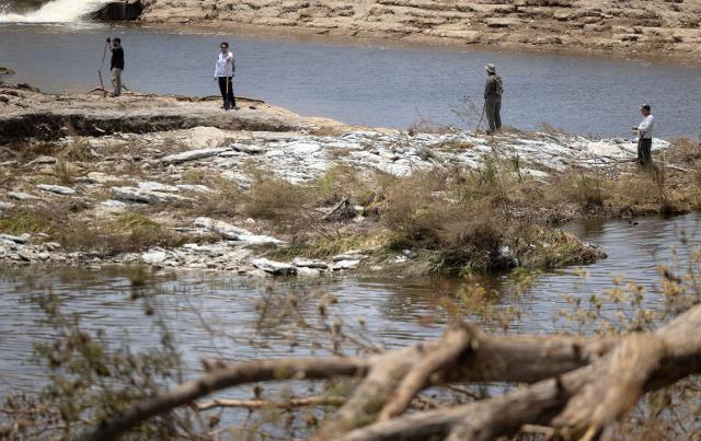 (250713) -- HOUSTON, July 13, 2025 (Xinhua) -- People search for victims near the Guadalupe River in Kerrville, Texas, the United States, on July 12, 2025. (Photo by Nick Wagner/Xinhua)