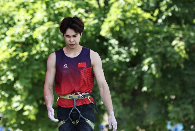 (250713) -- CHARMONIX, July 13, 2025 (Xinhua) -- Pan Yufei of China reacts during the men's lead semifinal of sport climbing at the 2025 IFSC Climbing World Cup Speed-Lead in Charmonix, France, July 13, 2025. (Xinhua/Gao Jing)