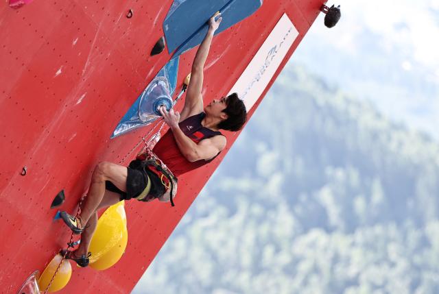 (250713) -- CHARMONIX, July 13, 2025 (Xinhua) -- Pan Yufei of China competes during the men's lead semifinal of sport climbing at the 2025 IFSC Climbing World Cup Speed-Lead in Charmonix, France, July 13, 2025. (Xinhua/Gao Jing)