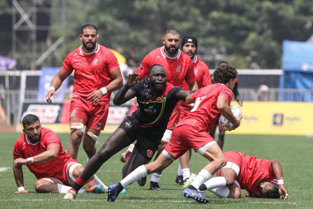 (250713) -- KAMPALA, July 13, 2025 (Xinhua) -- Llian El Yahyaoui (2nd R) of Morocco carries the ball during the Rugby Africa Cup 5th place playoff match between Uganda and Morocco in Kampala, Uganda, July 13, 2025. (Photo by Hajarah Nalwadda/Xinhua)