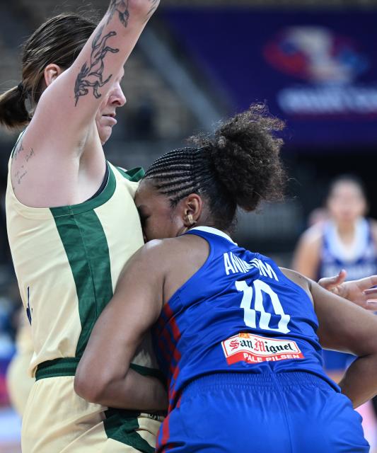 (250713) -- SHENZHEN, July 13, 2025 (Xinhua) -- Jack Animam (R) of the Philippines vies with Cayla George of Australia during the FIBA Women's Asia Cup Division A 2025 Group B match between Australia and the Philippines in Shenzhen, south China's Guangdong Province, July 13, 2025. (Xinhua/Deng Hua)