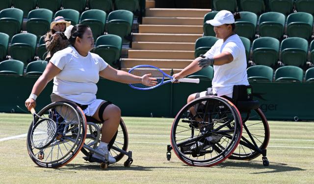 (250713) -- LONDON, July 13, 2025 (Xinhua) -- Li Xiaohui (R)/Wang Ziying react during the women's wheelchair doubles final between Li Xiaohui/Wang Ziying of China and Angelica Bernal (Colombia)/Ksenia Chasteau (France) at the Wimbledon Tennis Championships in London, Britain, July 13, 2025. (Xinhua/Zhao Dingzhe)