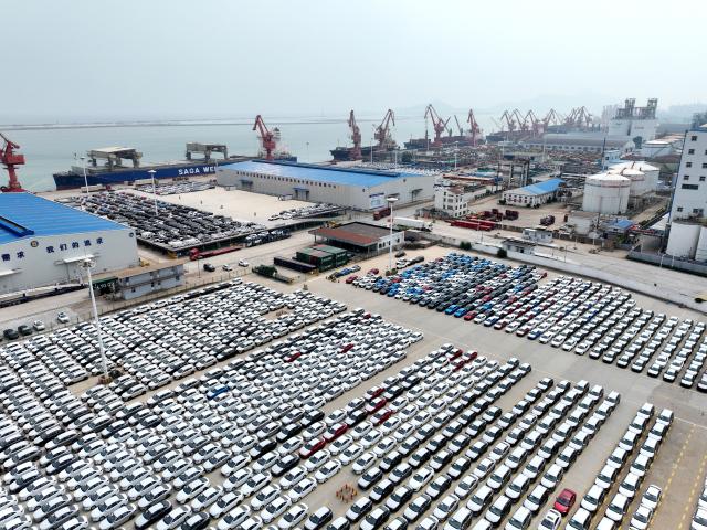 (250713) -- BEIJING, July 13, 2025 (Xinhua) -- This aerial photo taken on July 13, 2025 shows motor vehicles waiting to be exported at a port in Lianyungang City, east China's Jiangsu Province. China's maritime industry now handles nearly one-third of global maritime shipping volume, according to the 2025 China Maritime Day Forum held in the coastal town of Boao in south China's Hainan Province on Friday. China's booming marine economy is driving sustained and stable growth in global trade and development. (Photo by Wang Chun/Xinhua)
