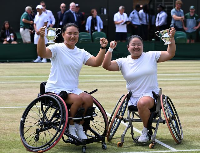 (250713) -- LONDON, July 13, 2025 (Xinhua) -- Li Xiaohui/Wang Ziying (R) celebrate during the awarding ceremony after the women's wheelchair doubles final between Li Xiaohui/Wang Ziying of China and Angelica Bernal (Colombia)/ Ksenia Chasteau (France) at the Wimbledon Tennis Championships in London, Britain, July 13, 2025. (Xinhua/Zhao Dingzhe)