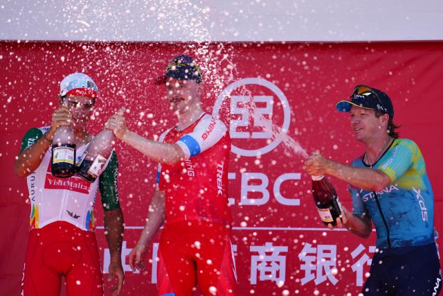 (250713) -- HAIYAN, July 13, 2025 (Xinhua) -- First placed Alexander Salby (C) of Li Ning Star, second placed Manuel Penalver Aniorte (L) of Team Polti Visitmalta and third placed Aaron Murray Gate of XDS Astana Team celebrate on the podium after Stage 8 of the Tour of Magnificent Qinghai International Road Cycling Race in Haiyan, northwest China's Qinghai Province, July 13, 2025. (Xinhua/Qi Zhiyue)