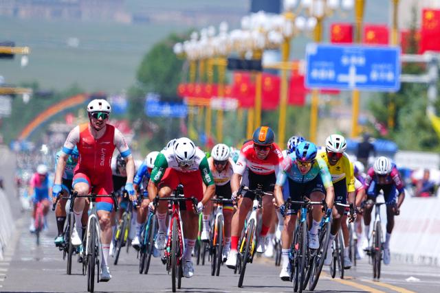 (250713) -- HAIYAN, July 13, 2025 (Xinhua) -- Cyclists compete during Stage 8 of the Tour of Magnificent Qinghai International Road Cycling Race in Haiyan, northwest China's Qinghai Province, July 13, 2025. (Xinhua/Qi Zhiyue)