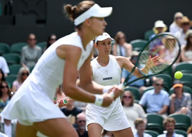 (250713) -- LONDON, July 13, 2025 (Xinhua) -- Veronika Kudermetova/Elise Mertens (R) compete during the women's doubles final between Hsieh Su-Wei (Chinese Taipei)/Jelena Ostapenko (Latvia) and Veronika Kudermetova (Russia)/Elise Mertens (Belgium) at the Wimbledon Tennis Championships in London, Britain, July 13, 2025. (Xinhua/Li Ying)