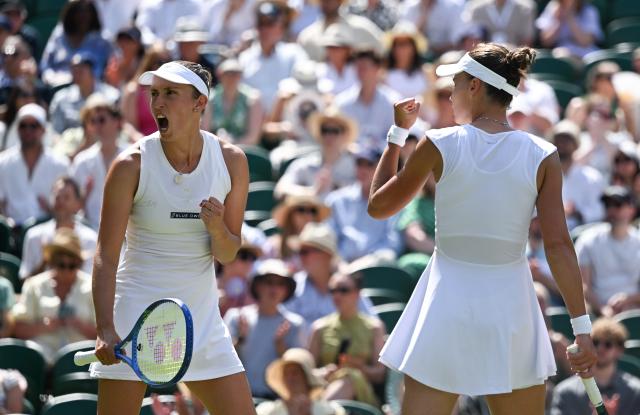 (250713) -- LONDON, July 13, 2025 (Xinhua) -- Veronika Kudermetova/Elise Mertens (L) celebrate during the women's doubles final between Hsieh Su-Wei (Chinese Taipei)/Jelena Ostapenko (Latvia) and Veronika Kudermetova (Russia)/Elise Mertens (Belgium) at the Wimbledon Tennis Championships in London, Britain, July 13, 2025. (Xinhua/Li Ying)