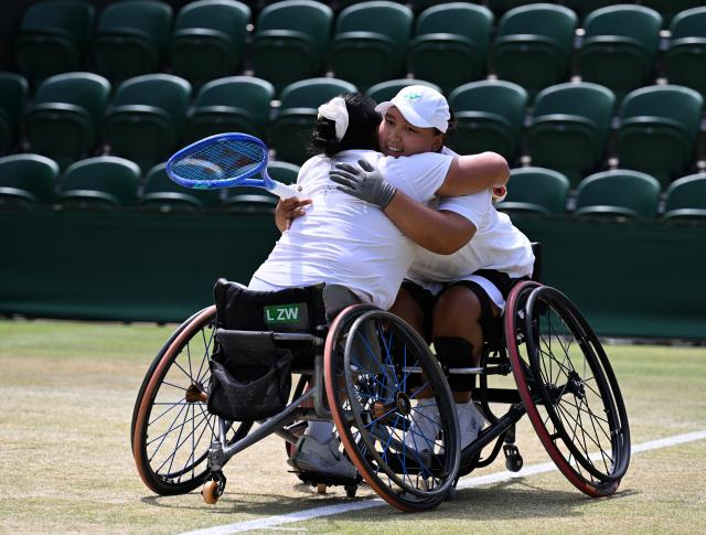 (250713) -- LONDON, July 13, 2025 (Xinhua) -- Li Xiaohui/Wang Ziying (L) celebrate after winning the women's wheelchair doubles final between Li Xiaohui/Wang Ziying of China and Angelica Bernal (Colombia)/Ksenia Chasteau (France) at the Wimbledon Tennis Championships in London, Britain, July 13, 2025. (Xinhua/Zhao Dingzhe)