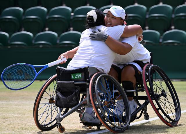 (250713) -- LONDON, July 13, 2025 (Xinhua) -- Li Xiaohui/Wang Ziying (L) celebrate after winning the women's wheelchair doubles final between Li Xiaohui/Wang Ziying of China and Angelica Bernal (Colombia)/Ksenia Chasteau (France) at the Wimbledon Tennis Championships in London, Britain, July 13, 2025. (Xinhua/Zhao Dingzhe)