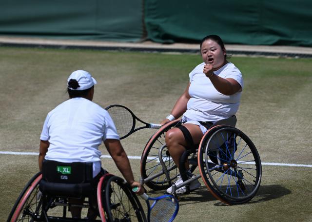 (250713) -- LONDON, July 13, 2025 (Xinhua) -- Li Xiaohui/Wang Ziying (R) react during the women's wheelchair doubles final between Li Xiaohui/Wang Ziying of China and Angelica Bernal (Colombia)/Ksenia Chasteau (France) at the Wimbledon Tennis Championships in London, Britain, July 13, 2025. (Xinhua/Zhao Dingzhe)
