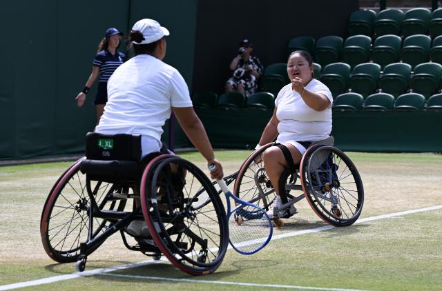 (250713) -- LONDON, July 13, 2025 (Xinhua) -- Li Xiaohui/Wang Ziying (R) react during the women's wheelchair doubles final between Li Xiaohui/Wang Ziying of China and Angelica Bernal (Colombia)/Ksenia Chasteau (France) at the Wimbledon Tennis Championships in London, Britain, July 13, 2025. (Xinhua/Zhao Dingzhe)