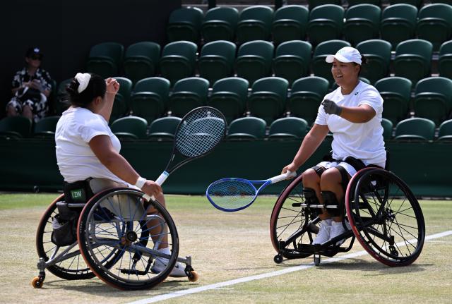 (250713) -- LONDON, July 13, 2025 (Xinhua) -- Li Xiaohui/Wang Ziying (L) celebrate after winning the women's wheelchair doubles final between Li Xiaohui/Wang Ziying of China and Angelica Bernal (Colombia)/Ksenia Chasteau (France) at the Wimbledon Tennis Championships in London, Britain, July 13, 2025. (Xinhua/Zhao Dingzhe)