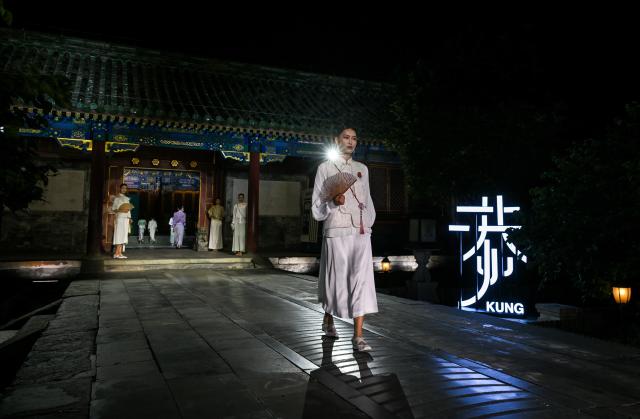 (250715) -- BEIJING, July 15, 2025 (Xinhua) -- A model presents a neo-Chinese ready-to-wear design during a fashion show held at the Prince Kung's Palace Museum in Beijing, capital of China, July 14, 2025. The fashion show is inspired by elements of the Prince Kung's Palace Museum and Chinese intangible cultural heritages, displaying 37 concept creations as well as 35 neo-Chinese ready-to-wear designs. (Xinhua/Jin Liangkuai)