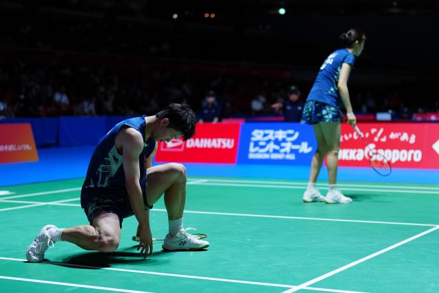 (250715) -- TOKYO, July 15, 2025 (Xinhua) -- Zhu Yijun (L)/Bao Lijing react during the mixed doubles round of 32 match between Zhu Yijun/Bao Lijing of China and Tang Chun Man/Tse Ying Suet of China's Hong Kong at the Japan Badminton Open 2025 in Tokyo, Japan, July 15, 2025. (Xinhua/Jia Haocheng)