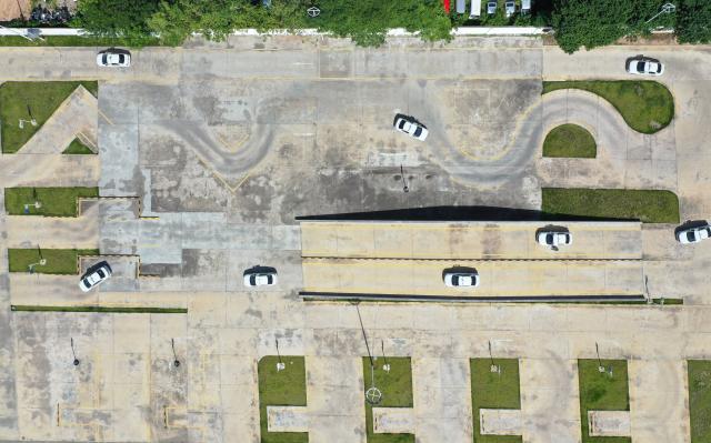 (250715) -- DONGYANG, July 15, 2025 (Xinhua) -- An aerial drone photo taken on July 2, 2025 shows trainees driving AI-driven training vehicles at the Xinlong driving school in Dongyang, east China's Zhejiang Province. The driving school has introduced an AI-assisted teaching system, which includes AI-driven training vehicles, indoor driving simulators, and AI-powered data management system. Equipped with 16 vehicle-borne radars and visual assistance system, each AI-driven training vehicle serves as an intelligent alternative to a driving coach, providing comprehensive and safe guidance for trainees. (Photo by Bao Kangxuan/Xinhua)