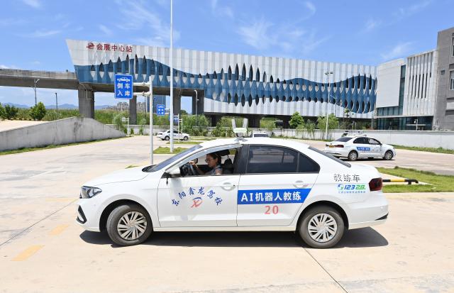 (250715) -- DONGYANG, July 15, 2025 (Xinhua) -- Trainees drive AI-driven training vehicles at the Xinlong driving school in Dongyang, east China's Zhejiang Province, July 5, 2025. The driving school has introduced an AI-assisted teaching system, which includes AI-driven training vehicles, indoor driving simulators, and AI-powered data management system. Equipped with 16 vehicle-borne radars and visual assistance system, each AI-driven training vehicle serves as an intelligent alternative to a driving coach, providing comprehensive and safe guidance for trainees. (Photo by Bao Kangxuan/Xinhua)