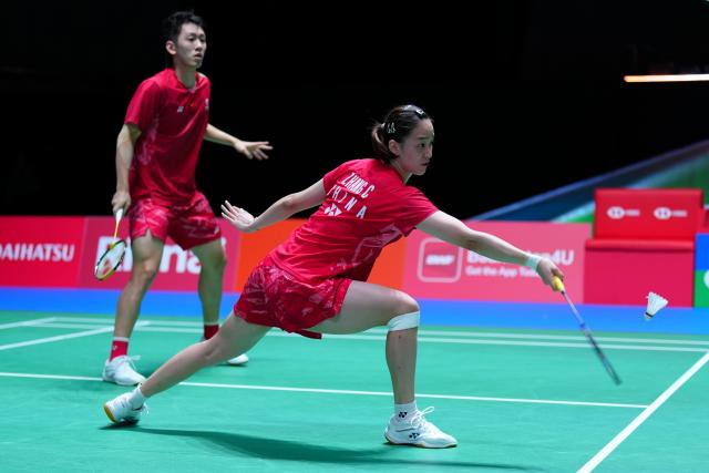 (250715) -- TOKYO, July 15, 2025 (Xinhua) -- Cheng Xing/Zhang Chi (R) compete during the mixed doubles round of 32 match between Cheng Xing/Zhang Chi of China and Amri Syahnawi/Nita Violina Marwah of Indonesia at the Japan Badminton Open 2025 in Tokyo, Japan, July 15, 2025. (Xinhua/Jia Haocheng)