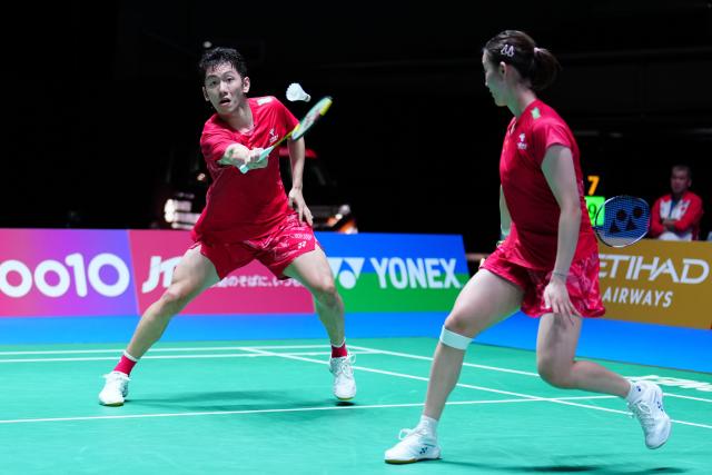 (250715) -- TOKYO, July 15, 2025 (Xinhua) -- Cheng Xing (L)/Zhang Chi compete during the mixed doubles round of 32 match between Cheng Xing/Zhang Chi of China and Amri Syahnawi/Nita Violina Marwah of Indonesia at the Japan Badminton Open 2025 in Tokyo, Japan, July 15, 2025. (Xinhua/Jia Haocheng)