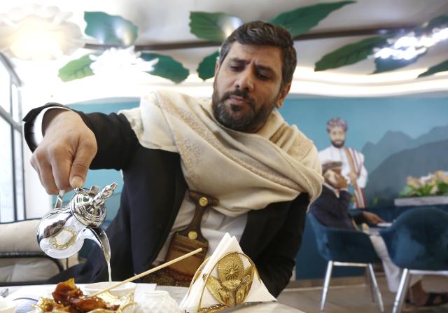 (250715) -- SANAA, July 15, 2025 (Xinhua) -- A man enjoys coffee at Haraaz Coffee in Sanaa, Yemen, on July 14, 2025. (Photo by Mohammed Mohammed/Xinhua)