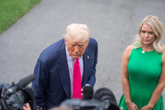 (250715) -- WASHINGTON, July 15, 2025 (Xinhua) -- U.S. President Donald Trump (L) takes questions at the White House in Washington, D.C., the United States, on July 15, 2025. Trump announced Tuesday that a 19 percent tariff will be imposed on imports from Indonesia while the United States will pay nothing, local media reported. (Xinhua/Hu Yousong)