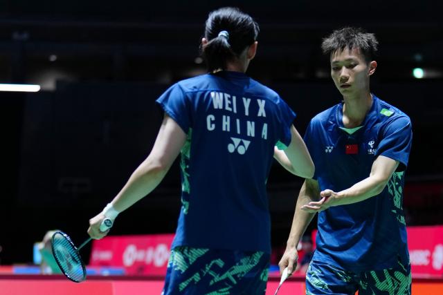 (250716) -- TOKYO, July 16, 2025 (Xinhua) -- Jiang Zhenbang (R)/Wei Yaxin celebrate scoring during the mixed doubles round of 32 match between Jiang Zhenbang/Wei Yaxin of China and Gao Jiaxuan/Wu Mengying of China at the Japan Badminton Open 2025 in Tokyo, Japan, July 16, 2025. (Xinhua/Jia Haocheng)