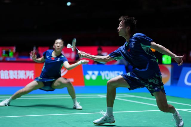 (250716) -- TOKYO, July 16, 2025 (Xinhua) -- Jiang Zhenbang (R)/Wei Yaxin compete during the mixed doubles round of 32 match between Jiang Zhenbang/Wei Yaxin of China and Gao Jiaxuan/Wu Mengying of China at the Japan Badminton Open 2025 in Tokyo, Japan, July 16, 2025. (Xinhua/Jia Haocheng)