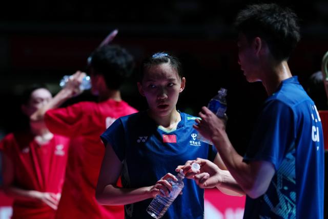 (250716) -- TOKYO, July 16, 2025 (Xinhua) -- Jiang Zhenbang/Wei Yaxin (L) react during the mixed doubles round of 32 match between Jiang Zhenbang/Wei Yaxin of China and Gao Jiaxuan/Wu Mengying of China at the Japan Badminton Open 2025 in Tokyo, Japan, July 16, 2025. (Xinhua/Jia Haocheng)