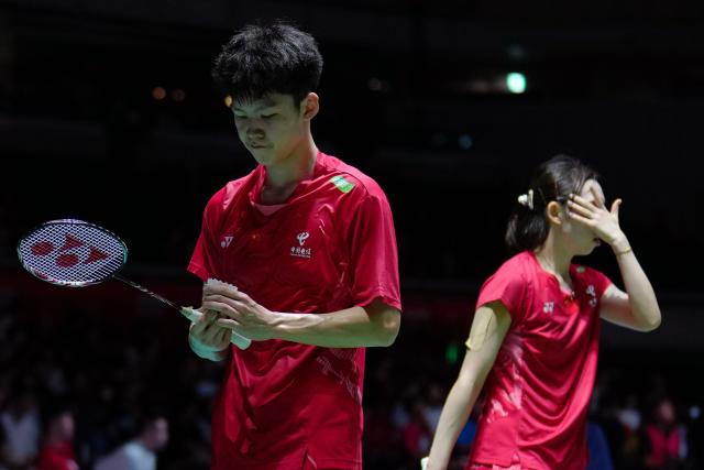 (250716) -- TOKYO, July 16, 2025 (Xinhua) -- Gao Jiaxuan (L)/Wu Mengying react during the mixed doubles round of 32 match between Jiang Zhenbang/Wei Yaxin of China and Gao Jiaxuan/Wu Mengying of China at the Japan Badminton Open 2025 in Tokyo, Japan, July 16, 2025. (Xinhua/Jia Haocheng)