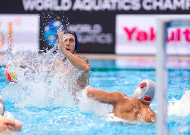 (250716) -- SINGAPORE, July 16, 2025 (Xinhua) -- Dmitrii Kholod (L) of Montenegro shoots during the men's preliminary round group D match of water polo between China and Montenegro at the World Aquatics Championships 2025 in Singapore, July 16, 2025. (Xinhua/Luo Yuan)