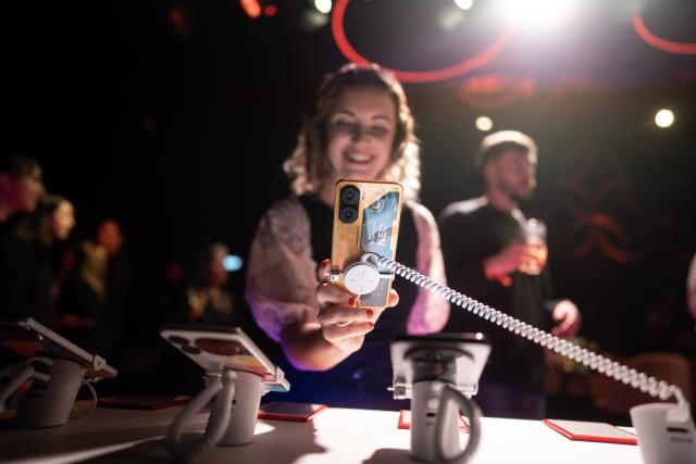 (250717) -- BUENOS AIRES, July 17, 2025 (Xinhua) -- A woman tries out a Nubia smartphone in Buenos Aires, Argentina, on July 15, 2025. Chinese tech company ZTE held a product launch event in Buenos Aires on Tuesday, unveiling 10 new Nubia-branded devices, including smartphones. According to the company, all the new products are assembled in Río Grande, Tierra del Fuego Province, and became available nationwide in Argentina starting July 16. (Photo by Martin Zabala/Xinhua)