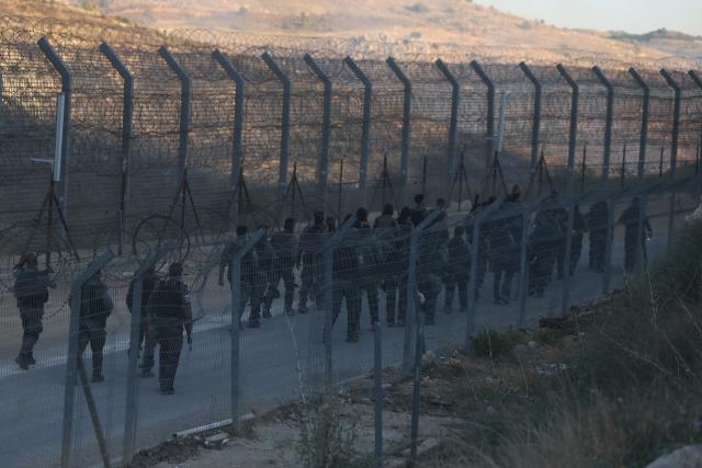 (250717) -- GOLAN HEIGHTS, July 17, 2025 (Xinhua) -- Israeli troops are seen in the Israeli-occupied Golan Heights, on July 16, 2025. Dozens of Druze citizens of Israel crossed from the Israeli-occupied Golan Heights into southern Syria on Tuesday afternoon, Israeli sources said, amid deadly clashes between Druze fighters and the Syrian interim government's forces.
   Israel's military said in a statement that troops were operating to return the civilians safely.
   The individuals crossed from Majdal Shams in the Israeli-occupied Golan Heights into the Druze village of Hader in southern Syria.
   According to Israel's Army Radio, the incident followed calls on social media by Druze in Lebanon to support their counterparts in Syria's southern province of Sweida.
   Israel launched a series of airstrikes on Tuesday targeting convoys of Syrian forces in and around the southern Syrian city of Sweida, killing and wounding several personnel and further escalating days of deadly clashes between local Druze armed factions, Bedouin tribes, and the Syrian interim government's forces.
   The Druze are a religious and ethnic minority originating from Islam, primarily living in Syria, Lebanon, and Israel, with smaller communities in Jordan and elsewhere. (Photo by Jamal Awad/Xinhua)