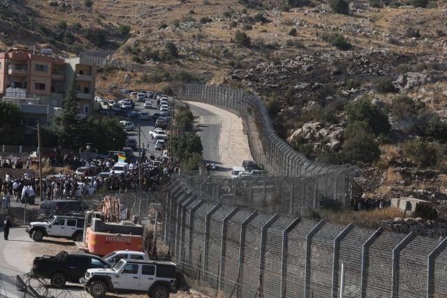 (250717) -- GOLAN HEIGHTS, July 17, 2025 (Xinhua) -- People of Druze community are seen in the buffer zone in the Golan Heights, on July 16, 2025. Dozens of Druze citizens of Israel crossed from the Israeli-occupied Golan Heights into southern Syria on Tuesday afternoon, Israeli sources said, amid deadly clashes between Druze fighters and the Syrian interim government's forces.
   Israel's military said in a statement that troops were operating to return the civilians safely.
   The individuals crossed from Majdal Shams in the Israeli-occupied Golan Heights into the Druze village of Hader in southern Syria.
   According to Israel's Army Radio, the incident followed calls on social media by Druze in Lebanon to support their counterparts in Syria's southern province of Sweida.
   Israel launched a series of airstrikes on Tuesday targeting convoys of Syrian forces in and around the southern Syrian city of Sweida, killing and wounding several personnel and further escalating days of deadly clashes between local Druze armed factions, Bedouin tribes, and the Syrian interim government's forces.
   The Druze are a religious and ethnic minority originating from Islam, primarily living in Syria, Lebanon, and Israel, with smaller communities in Jordan and elsewhere. (Photo by Jamal Awad/Xinhua)