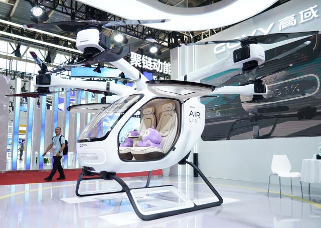 (250717) -- BEIJING, July 17, 2025 (Xinhua) -- A low-altitude aircraft is seen at the booth of the tech company GOVY in the Smart Vehicle Chain area of the third China International Supply Chain Expo (CISCE) in Beijing, capital of China, July 17, 2025. Held from July 16 to 20, the 2025 CISCE kicked off in Beijing on Wednesday. A key innovation for this edition is the "Debut Zone," dedicated to the global premieres of new products, technologies, and ecosystems, showcasing breakthrough innovations that drive industrial collaboration. (Xinhua/Zhang Chenlin)