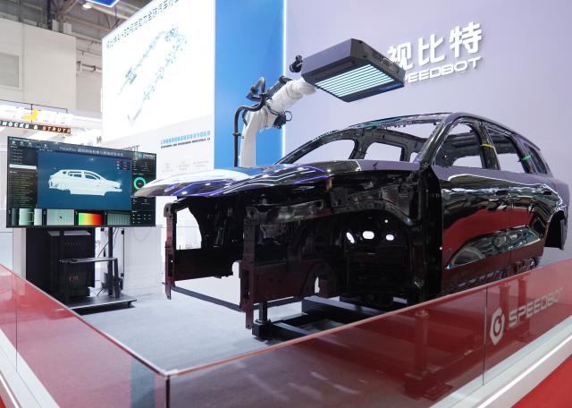 (250717) -- BEIJING, July 17, 2025 (Xinhua) -- A demonstration of the Paintpro system, which detects and repairs paint defects on vehicles, is seen at the booth of SpeedBot in the Smart Vehicle Chain area of the third China International Supply Chain Expo (CISCE) in Beijing, capital of China, July 17, 2025. Held from July 16 to 20, the 2025 CISCE kicked off in Beijing on Wednesday. A key innovation for this edition is the "Debut Zone," dedicated to the global premieres of new products, technologies, and ecosystems, showcasing breakthrough innovations that drive industrial collaboration. (Xinhua/Zhang Chenlin)