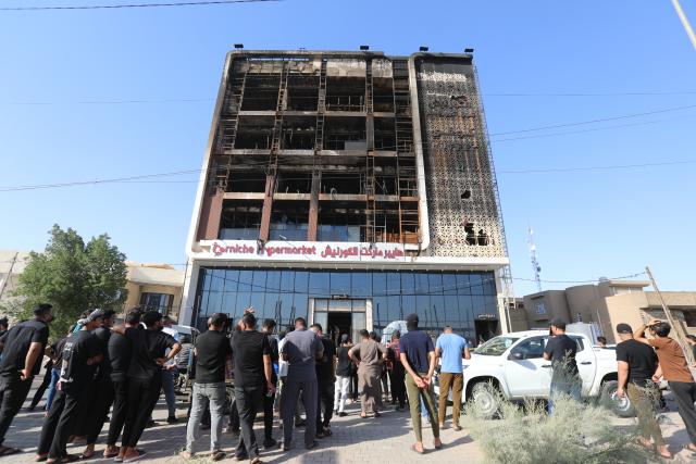 (250717) -- WASIT, July 17, 2025 (Xinhua) -- This photo taken on July 17, 2025 shows the building after a devastating fire was put out in Kut city, Wasit province, Iraq. The death toll from a devastating fire at a hypermarket in Kut, the capital of Iraq's Wasit province, has risen to 61, the Interior Ministry confirmed on Thursday. (Xinhua/Khalil Dawood)