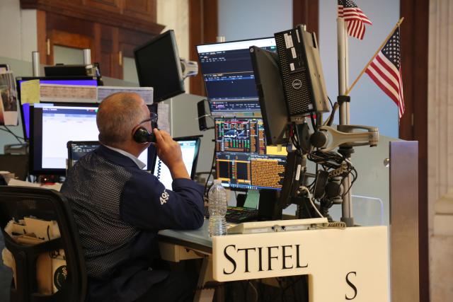 (250717) -- NEW YORK, July 17, 2025 (Xinhua) -- A trader works on the floor of the New York Stock Exchange in New York, the United States, on July 17, 2025. U.S. stocks ended higher on Thursday. The Dow Jones Industrial Average rose 0.52 percent to 44,484.49. The S&P 500 gained 0.54 percent to 6,297.36, while the Nasdaq Composite Index rose 0.75 percent to 20,885.65. (Xinhua/Liu Yanan)