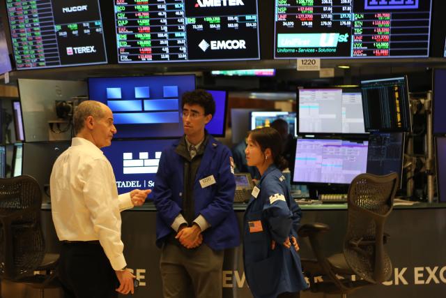 (250717) -- NEW YORK, July 17, 2025 (Xinhua) -- Traders talk on the floor of the New York Stock Exchange in New York, the United States, on July 17, 2025. U.S. stocks ended higher on Thursday. The Dow Jones Industrial Average rose 0.52 percent to 44,484.49. The S&P 500 gained 0.54 percent to 6,297.36, while the Nasdaq Composite Index rose 0.75 percent to 20,885.65. (Xinhua/Liu Yanan)