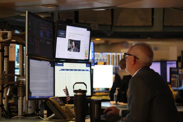 (250717) -- NEW YORK, July 17, 2025 (Xinhua) -- A trader works on the floor of the New York Stock Exchange in New York, the United States, on July 17, 2025. U.S. stocks ended higher on Thursday. The Dow Jones Industrial Average rose 0.52 percent to 44,484.49. The S&P 500 gained 0.54 percent to 6,297.36, while the Nasdaq Composite Index rose 0.75 percent to 20,885.65. (Xinhua/Liu Yanan)