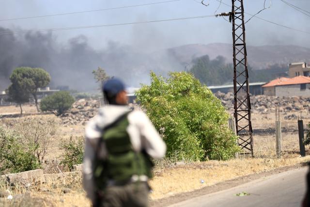 (250718) -- SWEIDA, July 18, 2025 (Xinhua) -- Smoke rises during clashes in the town of Wolgha, western countryside of Sweida, southern Syria, on July 18, 2025. The Syrian interim authorities on Friday issued a call for restraint amid escalating violence in the southern province of Sweida, pledging to deploy forces to contain the conflict. (Str/Xinhua)