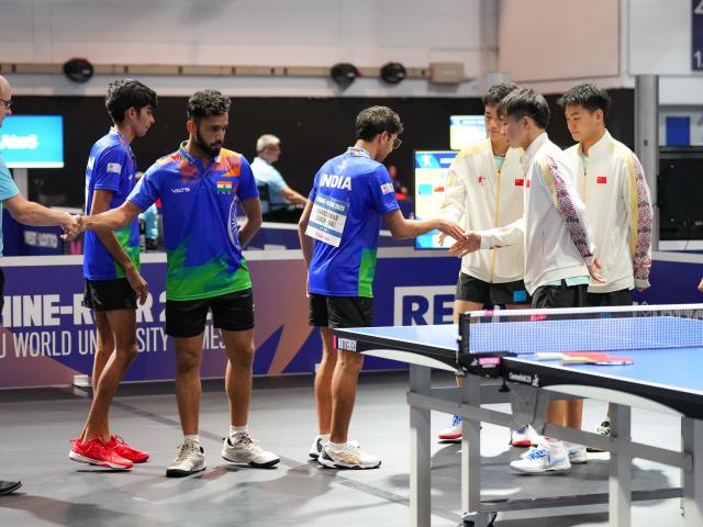 (250719) -- ESSEN, July 19, 2025 (Xinhua) -- Athletes of both teams greet before the men's team round of 16 match of table tennis between China and India at the Rhine-Ruhr 2025 FISU World University Games in Essen, Germany, July 18, 2025. (Xinhua/Wang Xi)