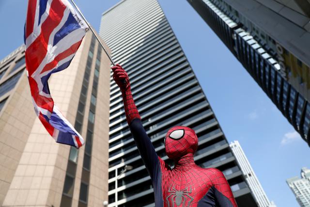(250811) -- LONDON, Aug. 11, 2025 (Xinhua) -- An anti-immigrant protester dressed as Spider-Man attends a demonstration outside the Britannia Hotel in Canary Wharf in London, Britain, on Aug. 10, 2025, against it's use to house asylum seekers. (Xinhua/Li Ying)