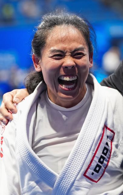 (250811) -- CHENGDU, Aug. 11, 2025 (Xinhua) -- Orapa Senatham of Thailand celebrates after defeating Chiara Fiorelli of Italy during the Women's -63kg Fighting Finals Gold Medal Match of Ju-Jitsu event at The World Games 2025 in Chengdu, southwest China's Sichuan Province, Aug. 11, 2025. (Xinhua/Jiang Hongjing)