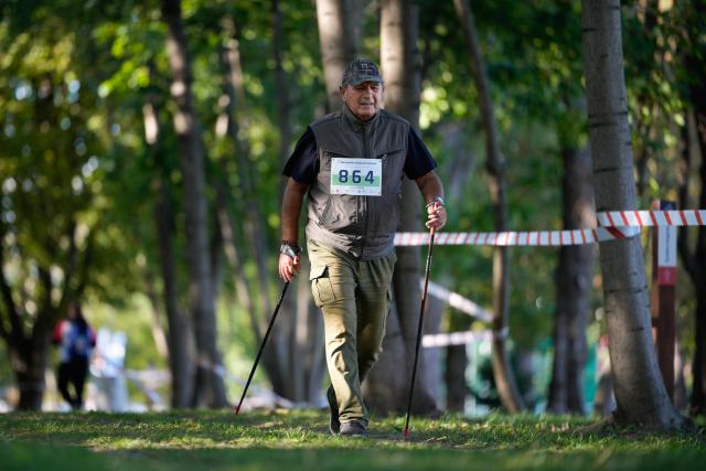 (250918) -- WARSAW, Sept. 18, 2025 (Xinhua) -- A participant walks with sticks in the Nordic walking match of the 7th Warsaw Senior Olympics in Warsaw, Poland on Sept. 17, 2025. The Warsaw Senior Olympics, an annual sporting event for people aged 60 and above, runs this year from September 14 to 20. (Photo by Jaap Arriens/Xinhua)