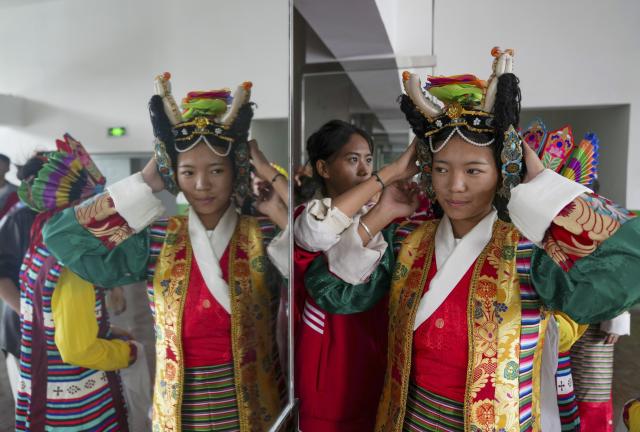 (250918) -- LHASA, Sept. 18, 2025 (Xinhua) -- Students put on Tibetan opera costumes at Lhasa No. 2 secondary vocational and technical school in Lhasa, southwest China's Xizang Autonomous Region, Sept. 9, 2025.
  Considered a living fossil of Tibetan culture, Tibetan opera blends talking, singing, acting, dancing and literature. It was included in the UNESCO Representative List of the Intangible Cultural Heritage of Humanity in 2009.
  With the government's support and the dedication of both young and old Tibetan opera enthusiasts, along with the efforts of intangible cultural heritage inheritors, this traditional art form is gaining new momentum on the plateau. (Xinhua/Jigme Dorje)