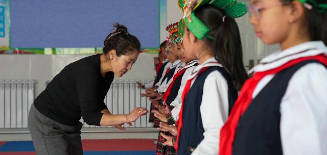 (250918) -- LHASA, Sept. 18, 2025 (Xinhua) -- A Tibetan opera teacher gives a lesson at Lhasa Experimental Primary School in Lhasa, southwest China's Xizang Autonomous Region, Sept. 11, 2025.
  Considered a living fossil of Tibetan culture, Tibetan opera blends talking, singing, acting, dancing and literature. It was included in the UNESCO Representative List of the Intangible Cultural Heritage of Humanity in 2009.
  With the government's support and the dedication of both young and old Tibetan opera enthusiasts, along with the efforts of intangible cultural heritage inheritors, this traditional art form is gaining new momentum on the plateau. (Xinhua/Jigme Dorje)