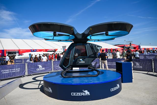 (250918) -- ISTANBUL, Sept. 18, 2025 (Xinhua) -- A flying car is displayed at the technology event TEKNOFEST in Istanbul, Türkiye, Sept. 17, 2025.
  The five-day event kicked off here on Wednesday, showcasing sci-tech advancements in fields such as aerospace, education and healthcare. (Xinhua/Liu Lei)