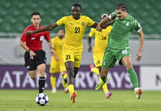 (250918) -- DOHA, Sept. 18, 2025 (Xinhua) -- Ayoub Amraoui (R) of Al Ahli vies with Mendy Dominique of Al Khaldiya during the group B match between Qatar's Al Ahli SC and Bahrain's Al Khaldiya SC of AFC Champions League Two in Doha, Qatar, Sept. 17, 2025. (Photo by Nikku/Xinhua)