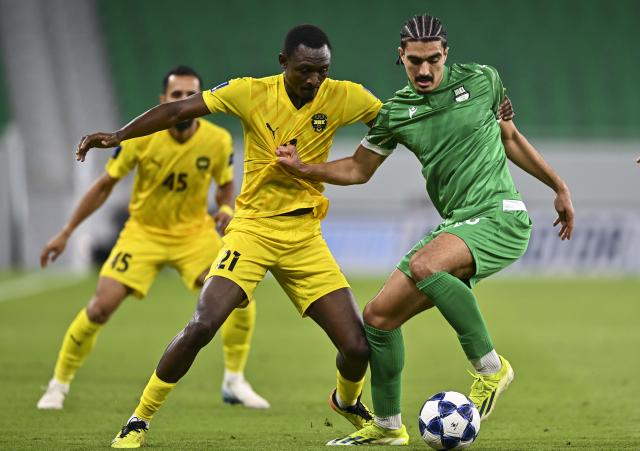 (250918) -- DOHA, Sept. 18, 2025 (Xinhua) -- Ayoub Amraoui (R) of Al Ahli vies with Mendy Dominique of Al Khaldiya during the group B match between Qatar's Al Ahli SC and Bahrain's Al Khaldiya SC of AFC Champions League Two in Doha, Qatar, Sept. 17, 2025. (Photo by Nikku/Xinhua)