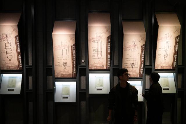 (250918) -- HARBIN, Sept. 18, 2025 (Xinhua) -- Visitors look at the drawing of bacteria bomb developed by Unit 731 at the Exhibition Hall of Evidence of Crimes Committed by Unit 731 of the Japanese Imperial Army in Harbin, capital of northeast China's Heilongjiang Province, Sept. 18, 2025. "The real history is far more brutal than what the film can depict," said Jin Chengmin, curator of the Exhibition Hall of Evidence of Crime Committed by Unit 731 of the Japanese Imperial Army.
  Unit 731, a top-secret biological and chemical warfare research base, was established in the Pingfang District of Harbin, and served as the nerve center for Japanese biological warfare in China and Southeast Asia during World War II.
   Historical records suggest that between 1940 and 1945, at least 3,000 people were used in human experiments by Unit 731, while more than 300,000 people in China were killed by Japan's biological weapons. (Xinhua/Zhang Tao)